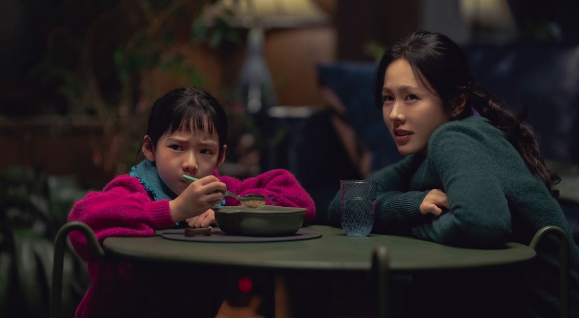 Lee Miri sits with her daughter in No Other Choice