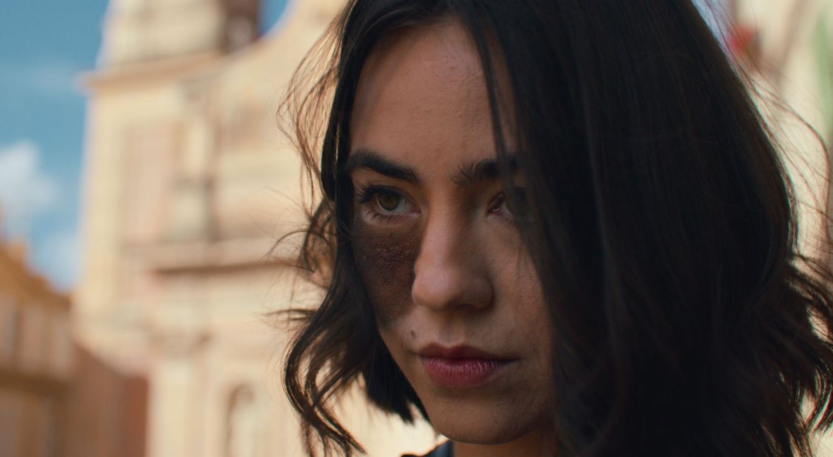 REVIEW: 'Influencers' Is A Great Sequel You Might Not Be Expecting 2 CW with an ominous expression looking off into the distance in Influencers