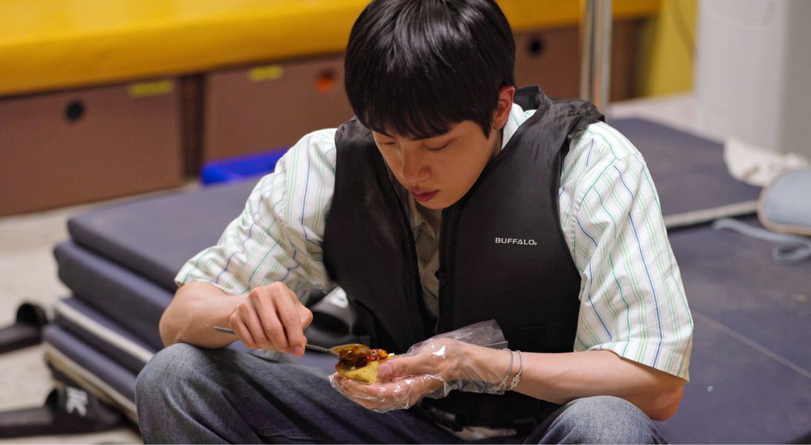 Jin cooks for the guests