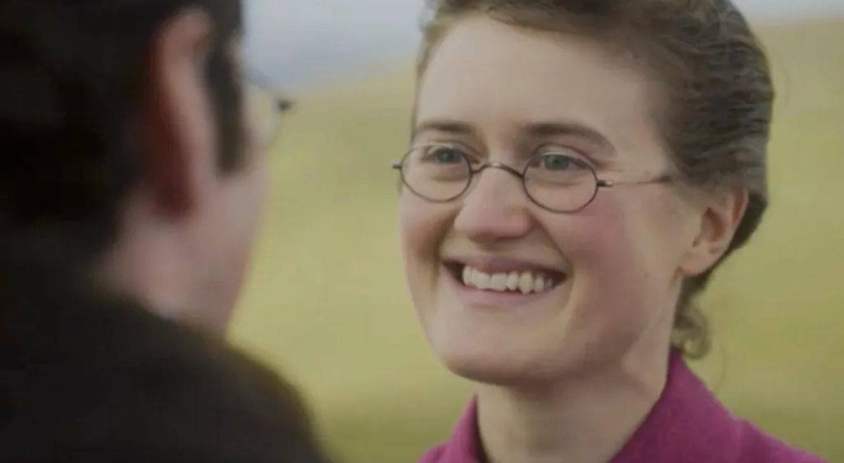 Mary smiling at Tom