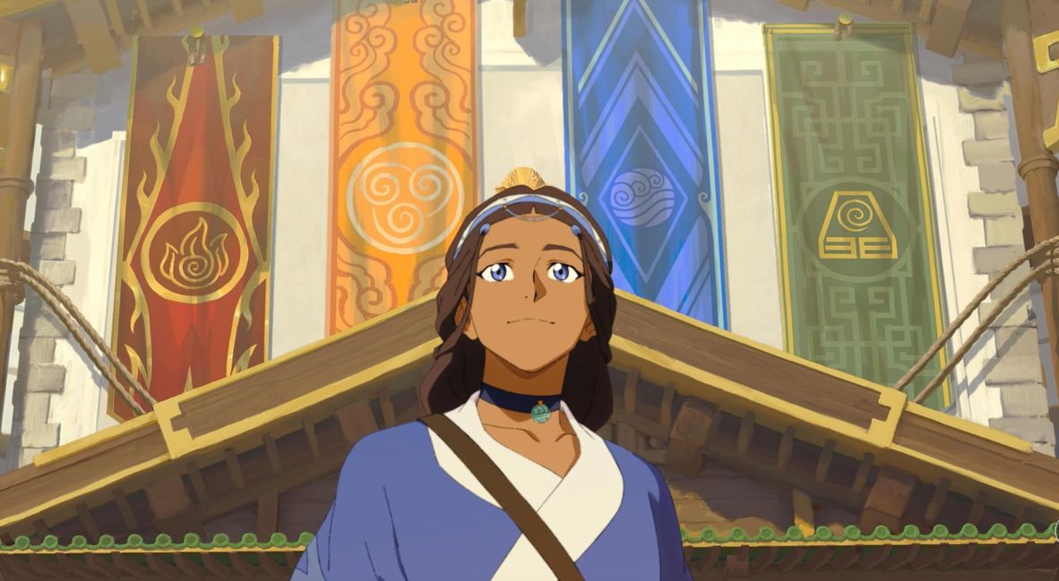 Katara stands before the flags of Republic City