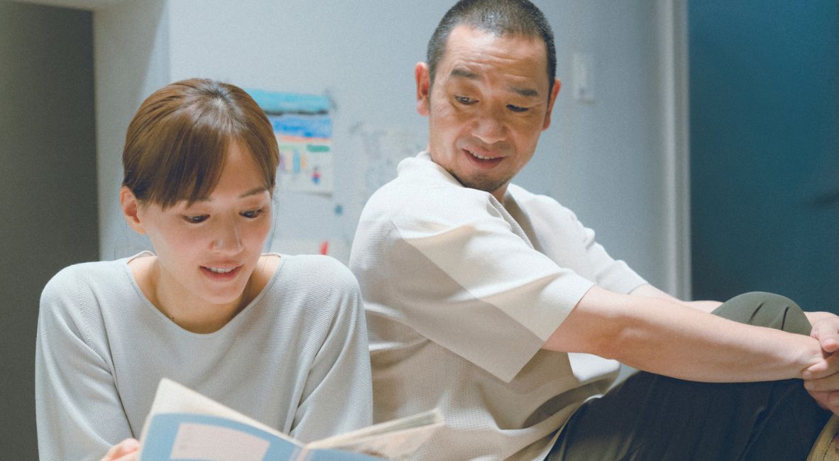 Hirokazu Koreeda On The Shape of Grief In His Latest, 'Sheep in a Box' 2 Otone and Kensuke read a book together