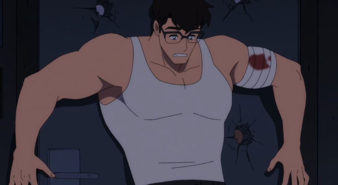 Clark blocks a door with bullet holes 