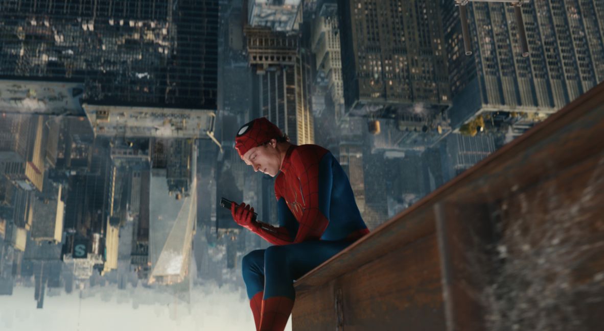 Peter Parker hangs upside down in his Spider-Man suit