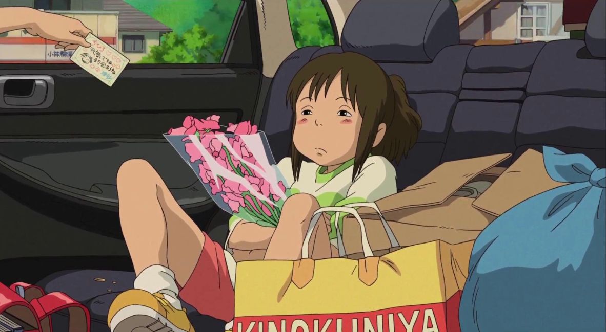 Chihiro unhappy in the back of the car