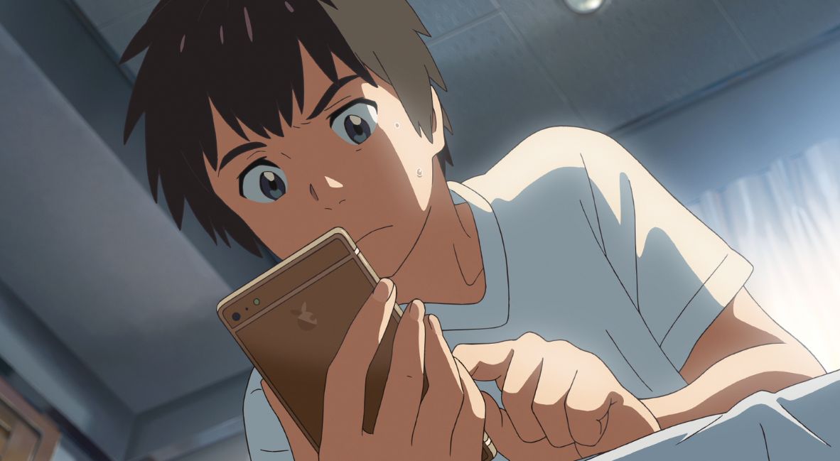 'Your Name' Continues to Mesmerize And Charm, 10 Years Later 2 Taki on his phone