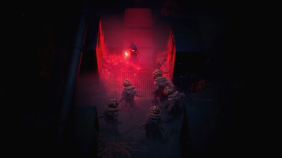 A hoard of enemies lit up by a red flare