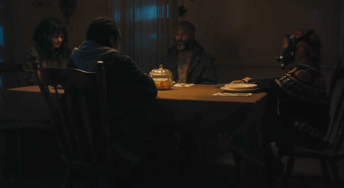 The raiders and pumpkin sit at the table