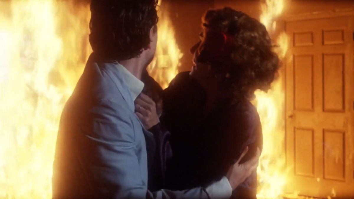 Two characters caught in a fire in A Day of Judgement