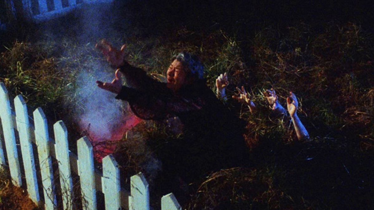 Mrs. Fitch struggles in her garden