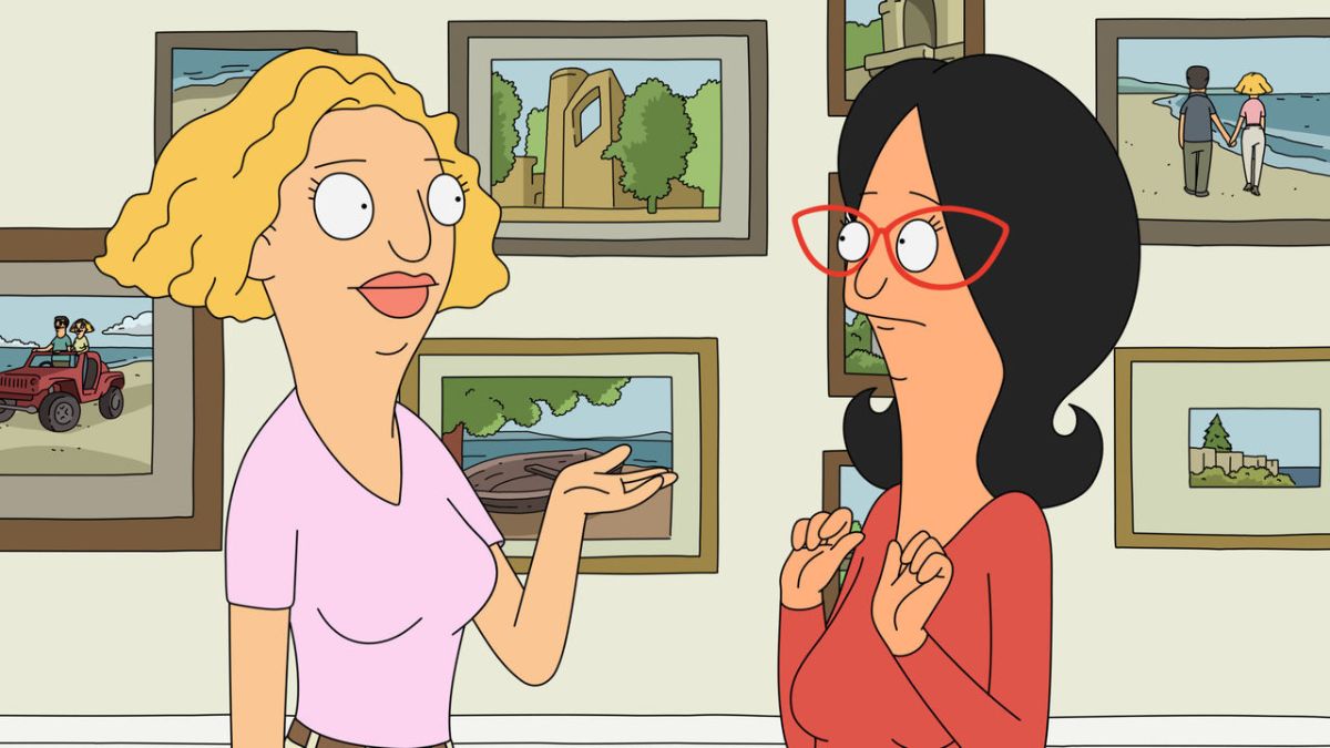 Helen and Linda in front of photographs 