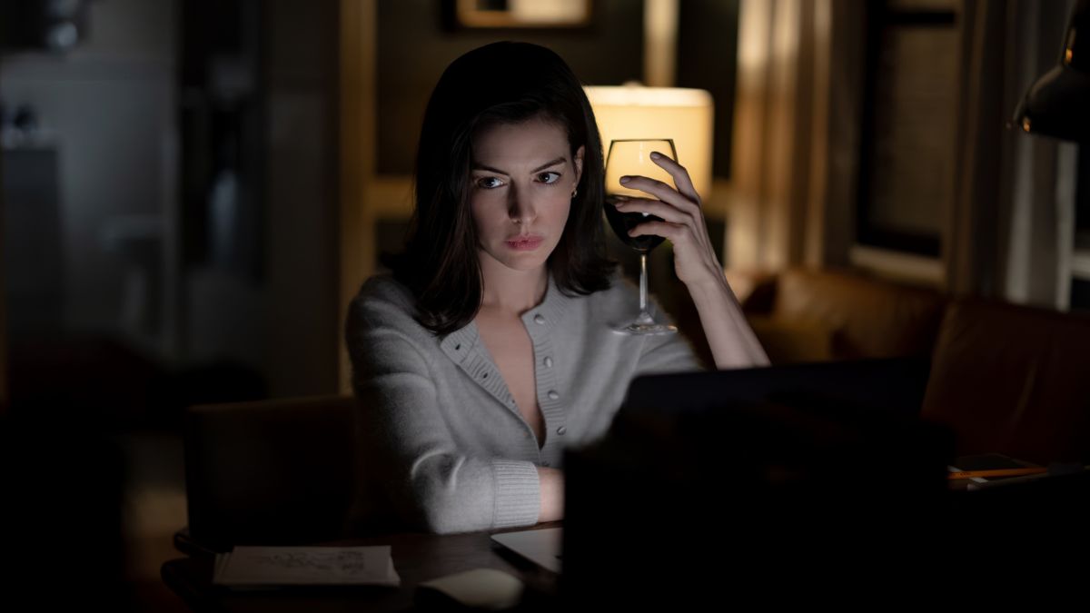 Verity holds a glass of wine